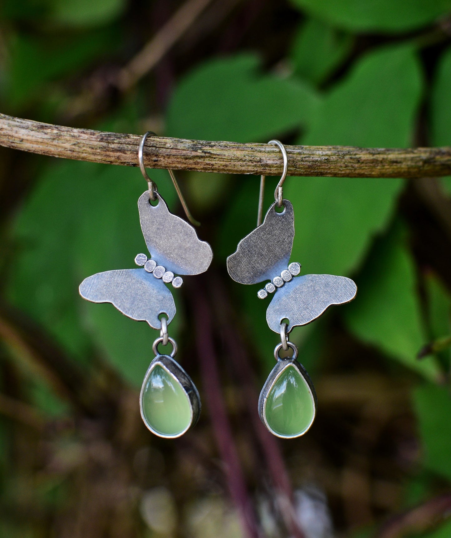 Butterfly earrings, sterling silver and peridot
