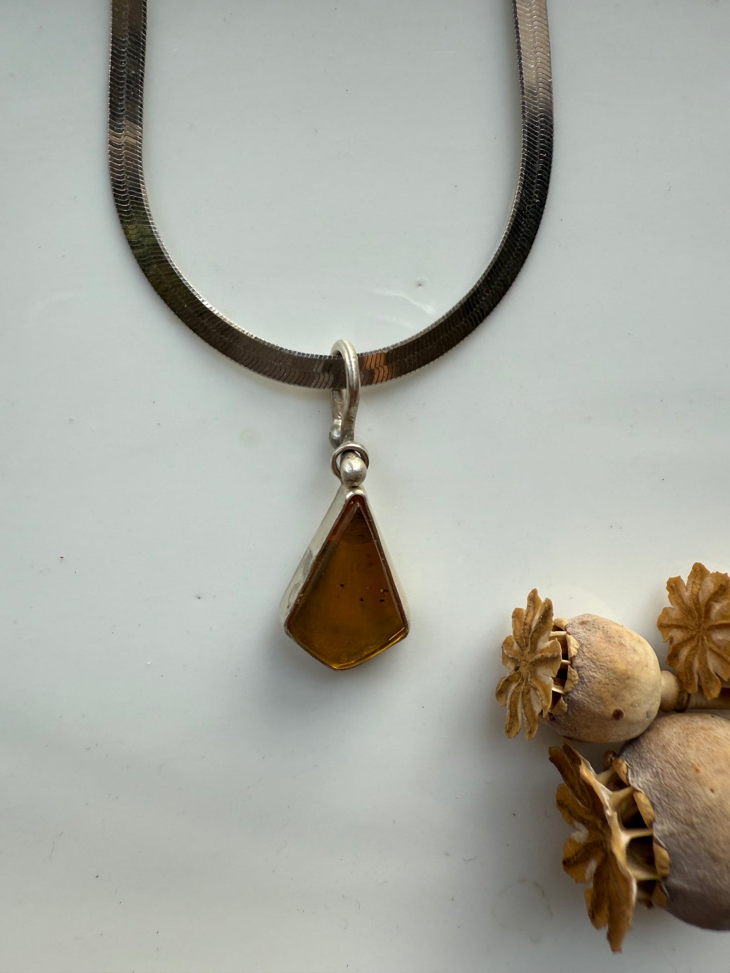 Amber herringbone pendant necklace